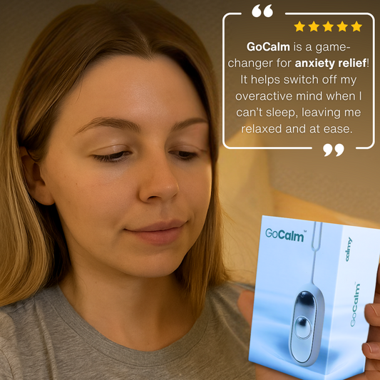 Woman using GoCalm™ acupressure device for natural anxiety relief