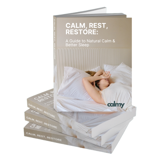 Three books titled 'CALM, REST, RESTORE: A Guide to Natural Calm & Better Sleep' stacked and fanned out on a white background. The top book is open, showing a cover with a woman resting in bed, and the word 'calmy' appears near the bottom.